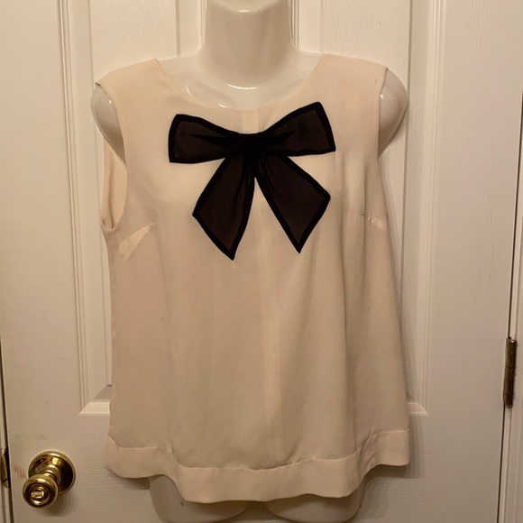 Float, Cream-Colored Top with Black Bow detail. - Picture 1 of 1